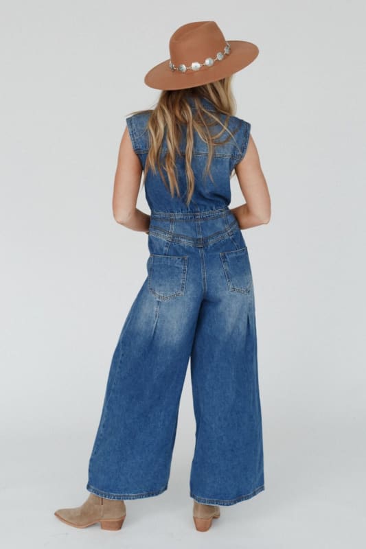back view of All Star Denim Jumpsuit in Medium Wash from Three Bird Nest