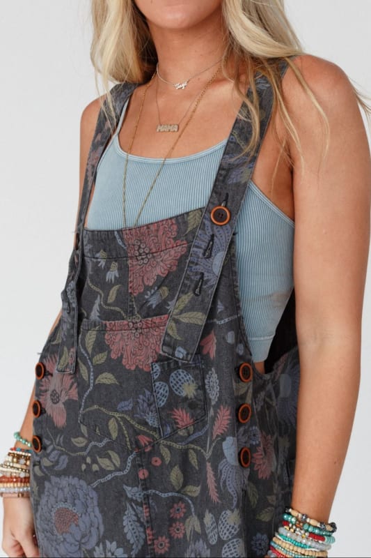 front detail of High Hopes Slouchy Denim Overalls in Floral Black Denim from Three Bird Nest