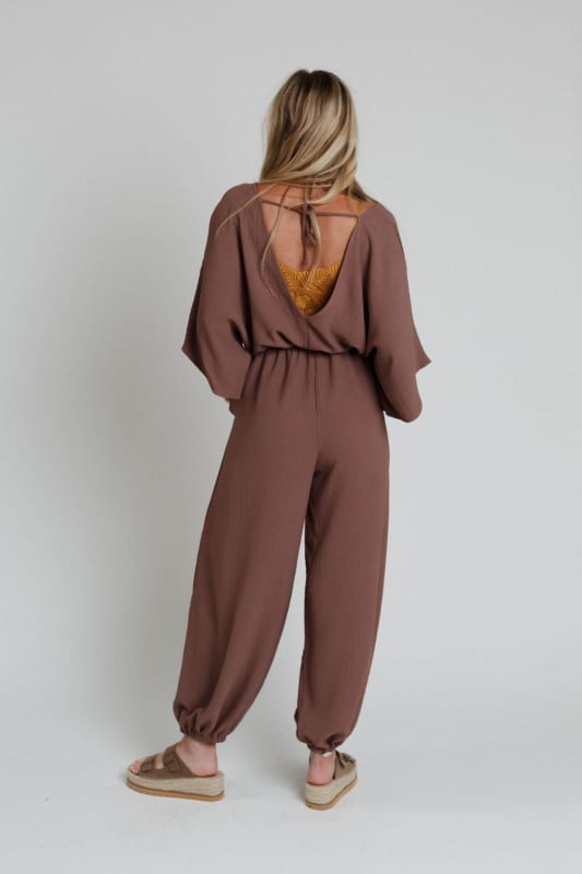 back view of The Nest New Love Relaxed Drawstring Jumpsuit in Mocha from Three Bird Nest