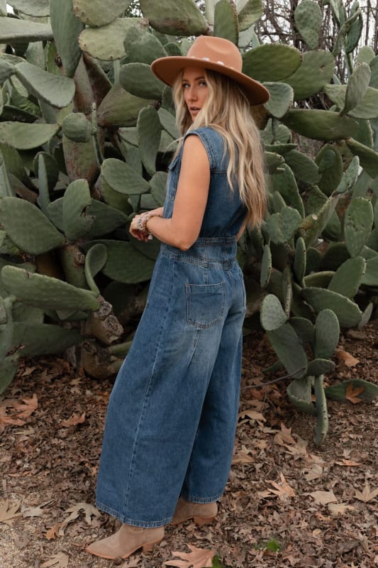 side view of All Star Denim Jumpsuit in Medium Wash from Three Bird Nest