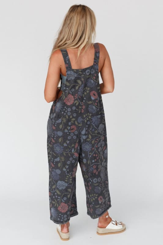 back view of High Hopes Slouchy Denim Overalls in Floral Black Denim from Three Bird Nest